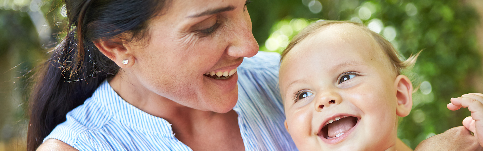 Mother and baby laughing